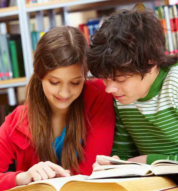teens-reading teenagers reading in a library