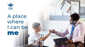 me A Third Academy student and teacher sharing a supportive fist bump.